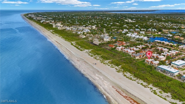 aerial view featuring a water view and a beach view