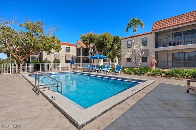 view of swimming pool with a patio area