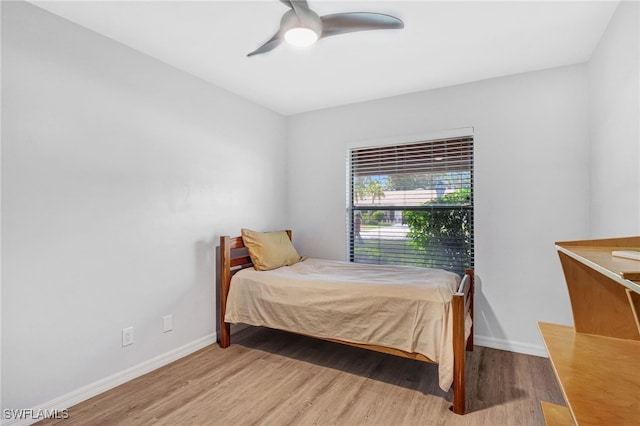 bedroom featuring ceiling fan and hardwood / wood-style flooring