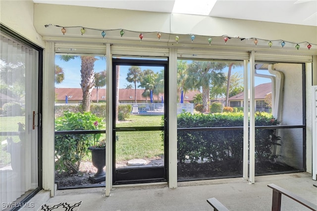 entryway with a skylight and concrete flooring