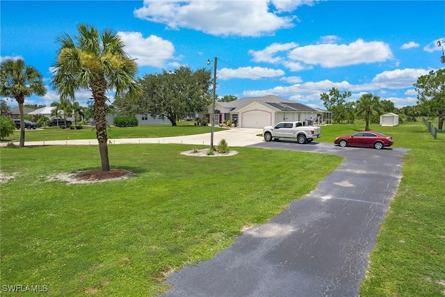 view of yard with a garage