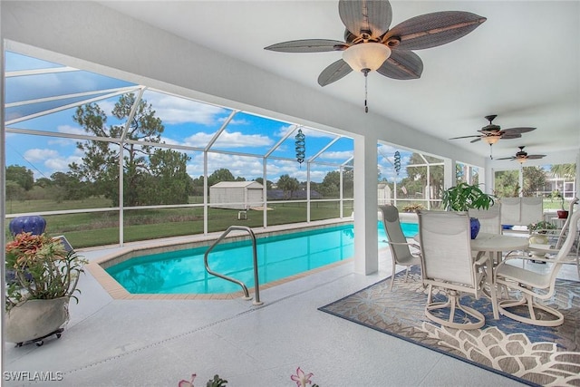 view of pool featuring a patio and glass enclosure