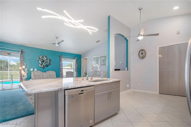 kitchen with dishwasher, a kitchen island with sink, lofted ceiling, and sink