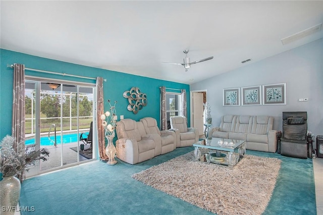 living room with carpet, vaulted ceiling, and ceiling fan