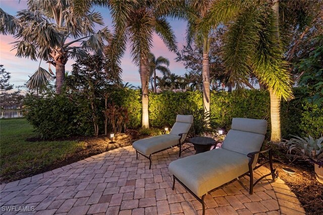 view of patio terrace at dusk