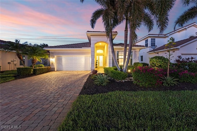 mediterranean / spanish-style house featuring a garage