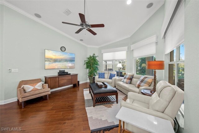 living room featuring ornamental molding, vaulted ceiling, ceiling fan, and dark wood-type flooring