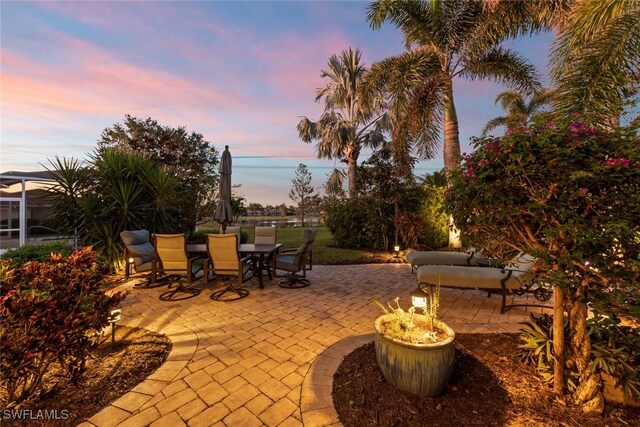 view of patio terrace at dusk