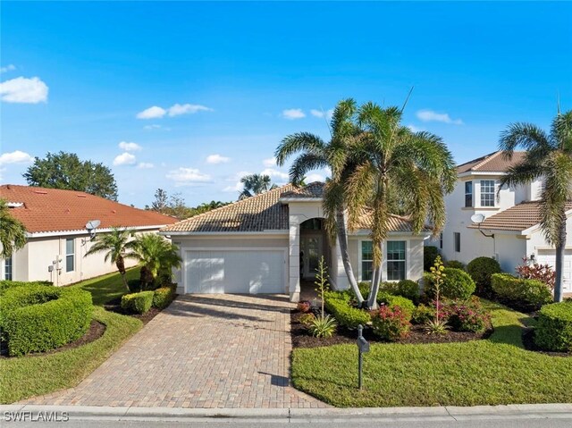 mediterranean / spanish-style house featuring a garage