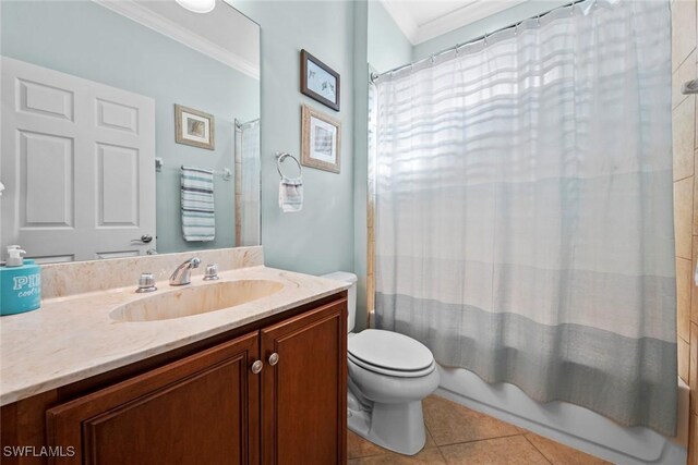 full bathroom with shower / bath combo, tile patterned floors, crown molding, toilet, and vanity