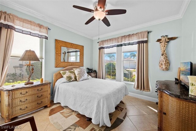 tiled bedroom featuring ceiling fan and ornamental molding