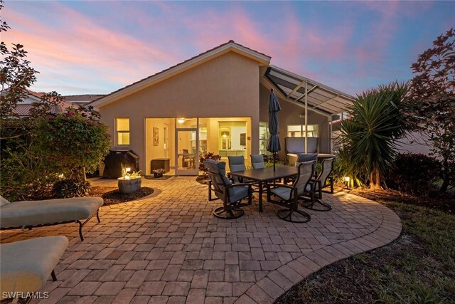 view of patio terrace at dusk