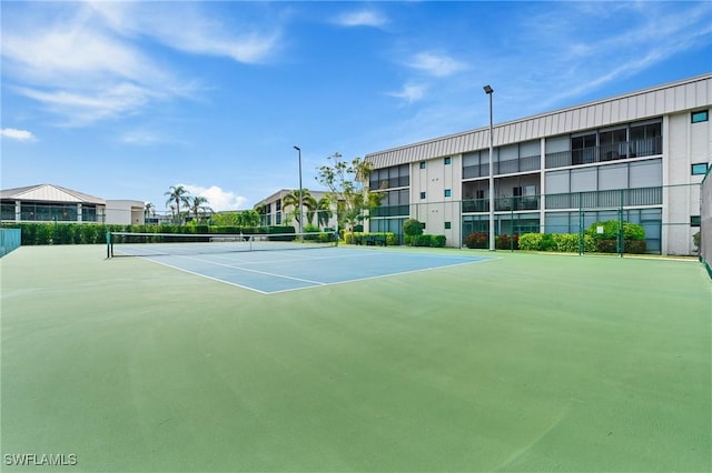 view of sport court featuring basketball hoop