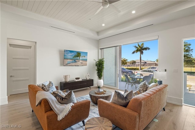 living room featuring wooden ceiling, light wood-style floors, baseboards, and recessed lighting