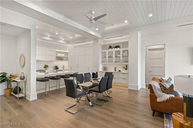 dining room with baseboards, a ceiling fan, wooden ceiling, light wood-style flooring, and recessed lighting