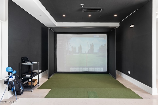 cinema room featuring light wood-type flooring, baseboards, golf simulator, and recessed lighting