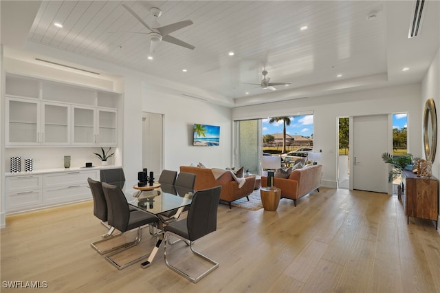 dining room with light wood-style floors, wood ceiling, and recessed lighting