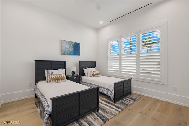 bedroom with light wood-style flooring, baseboards, a ceiling fan, and recessed lighting