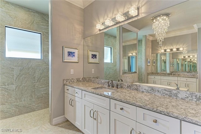 bathroom featuring vanity, ornamental molding, a chandelier, and a tile shower