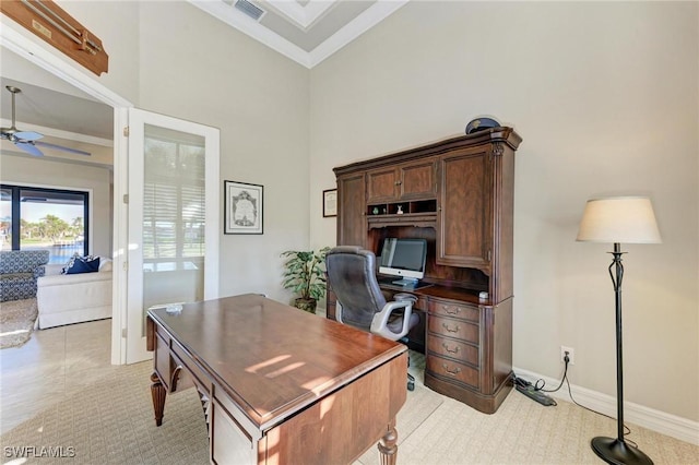 home office featuring a towering ceiling and ceiling fan