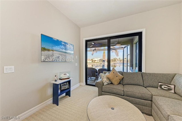 carpeted living room featuring ceiling fan