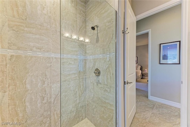 bathroom with tiled shower