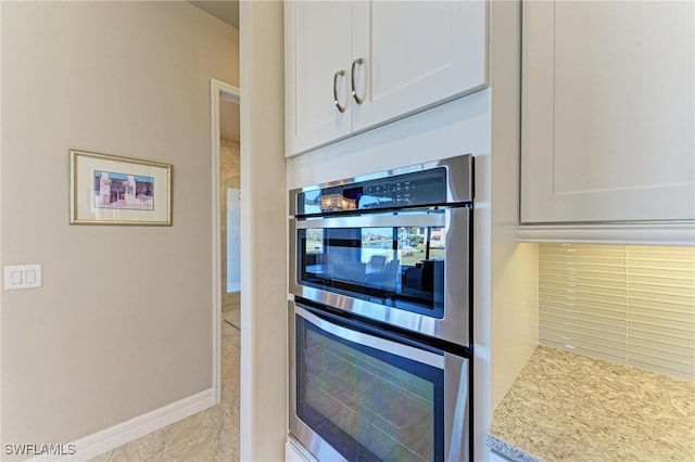 kitchen featuring white cabinetry and double oven