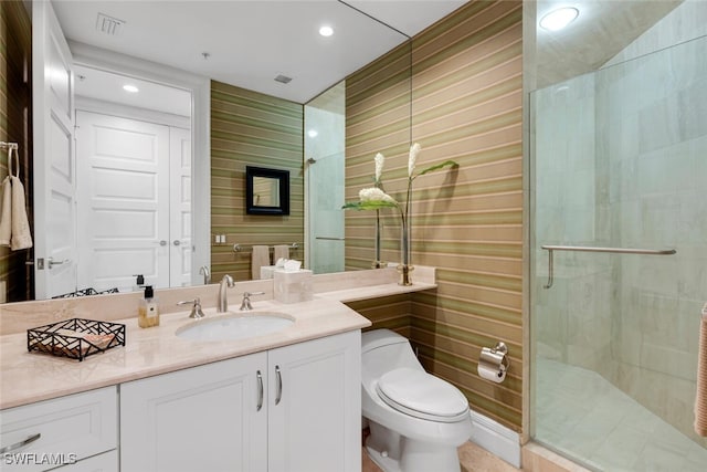 full bath featuring toilet, recessed lighting, visible vents, vanity, and a stall shower