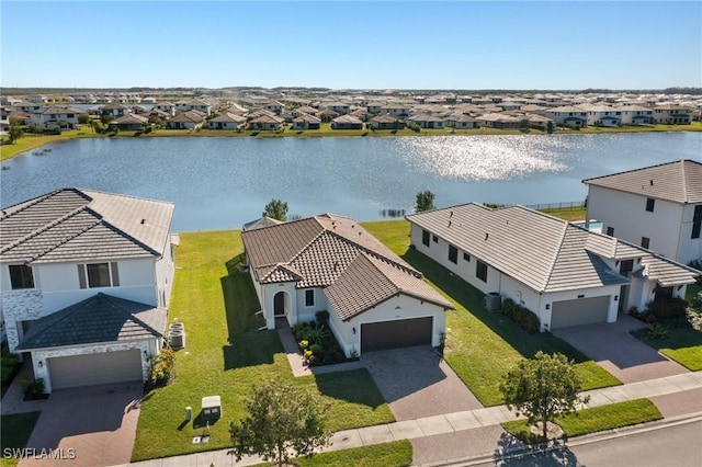 birds eye view of property featuring a water view