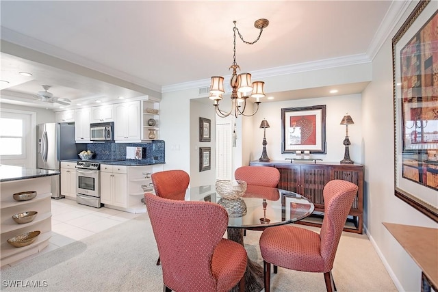 dining space featuring light colored carpet, ceiling fan with notable chandelier, and ornamental molding