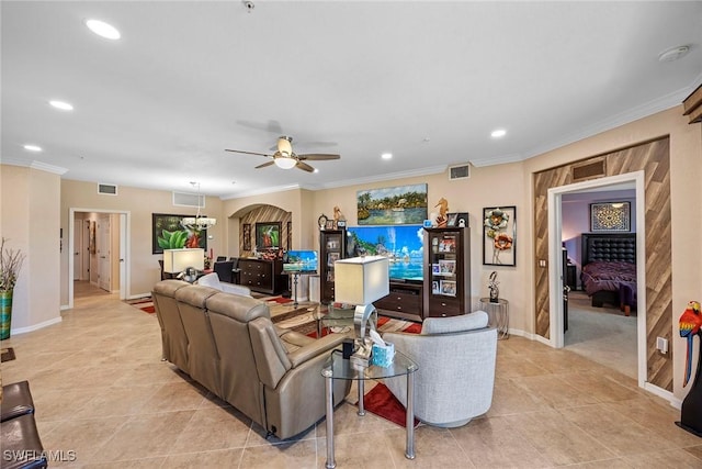 living room featuring ceiling fan, light tile patterned flooring, and ornamental molding