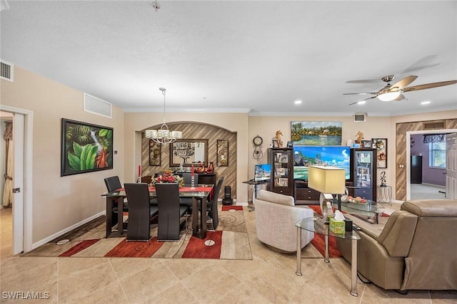 dining space featuring ceiling fan with notable chandelier, light tile patterned flooring, and ornamental molding