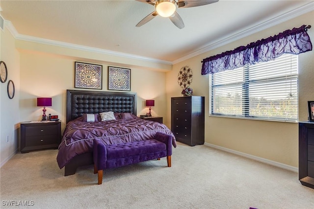 carpeted bedroom with ceiling fan and ornamental molding