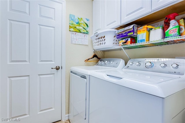 laundry room with cabinets and separate washer and dryer