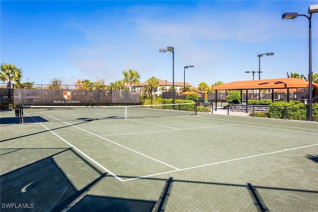 view of sport court with basketball hoop