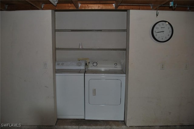 washroom with washer and dryer