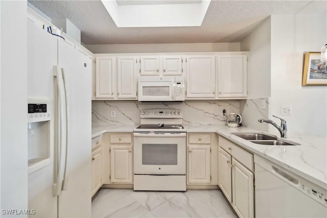 kitchen with backsplash, sink, a textured ceiling, and white appliances