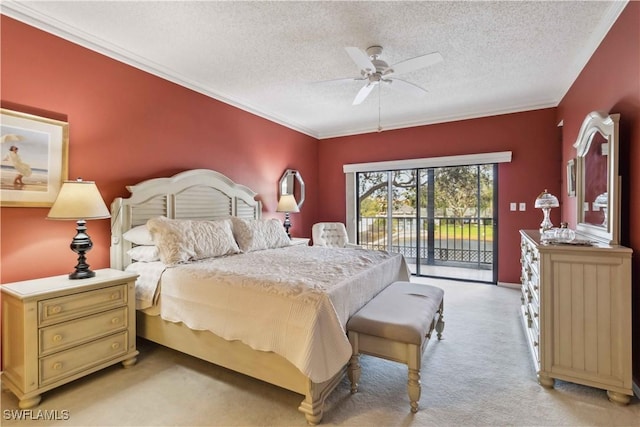 carpeted bedroom featuring a textured ceiling, access to outside, ceiling fan, and crown molding