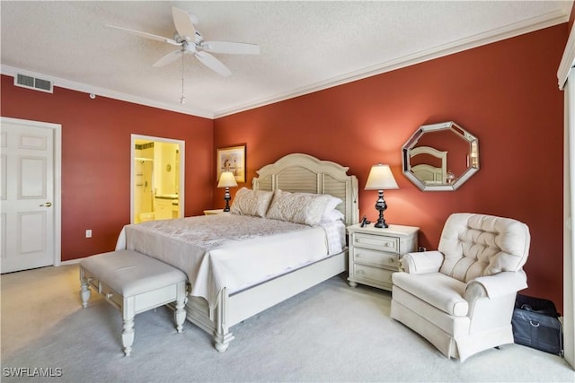 bedroom featuring connected bathroom, ceiling fan, a textured ceiling, carpet, and ornamental molding