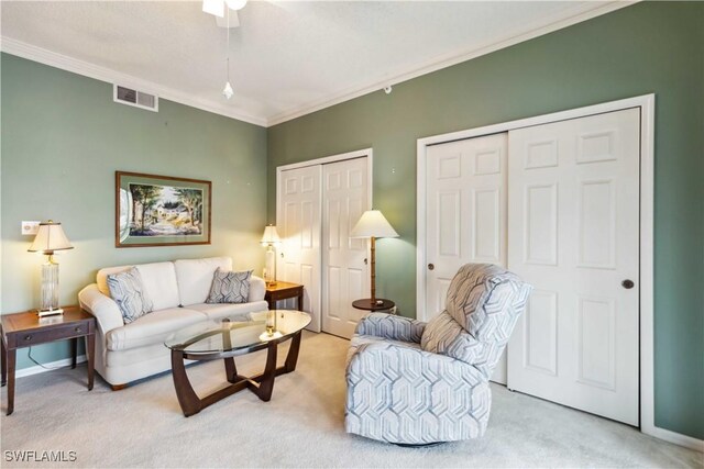 living room with carpet floors and crown molding