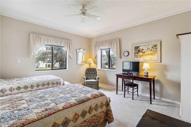 bedroom with light colored carpet, multiple windows, ornamental molding, and ceiling fan