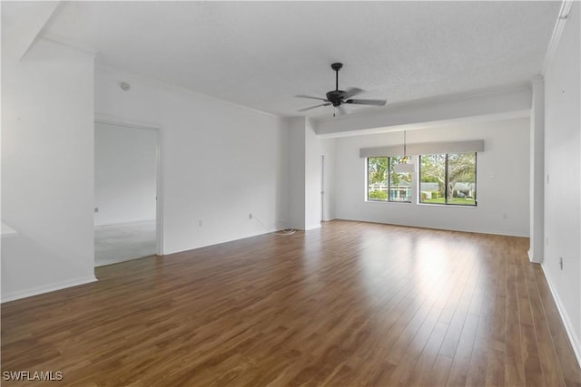 unfurnished room with wood finished floors and a ceiling fan