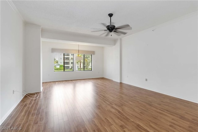 unfurnished room with ceiling fan and wood finished floors