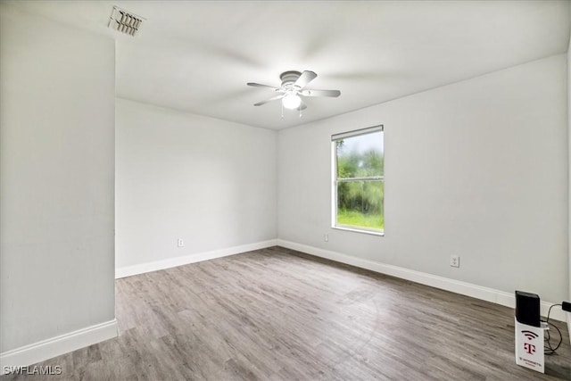 empty room featuring ceiling fan and wood-type flooring