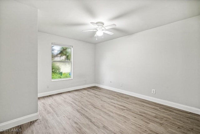 unfurnished room featuring ceiling fan and light hardwood / wood-style floors