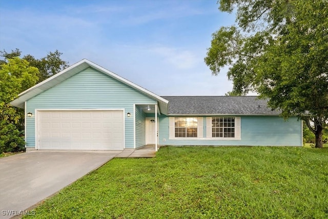 single story home with a garage and a front lawn