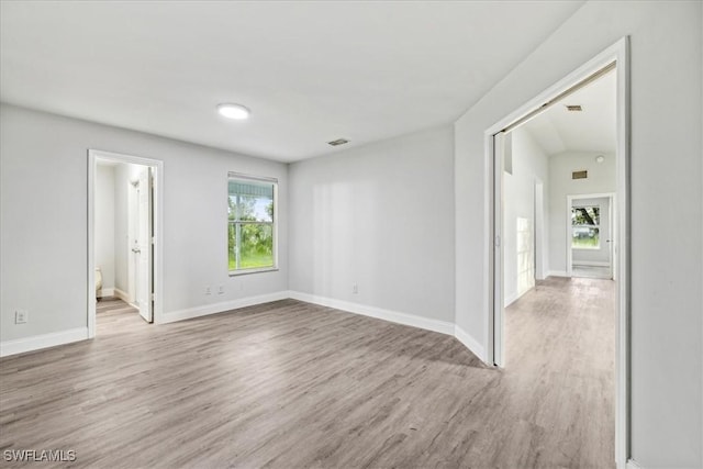 spare room with light wood-type flooring