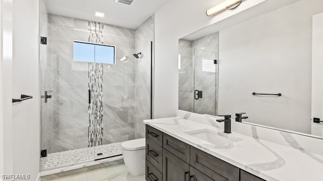 bathroom with vanity, an enclosed shower, and toilet