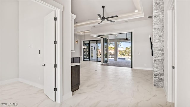 interior space featuring a raised ceiling and french doors