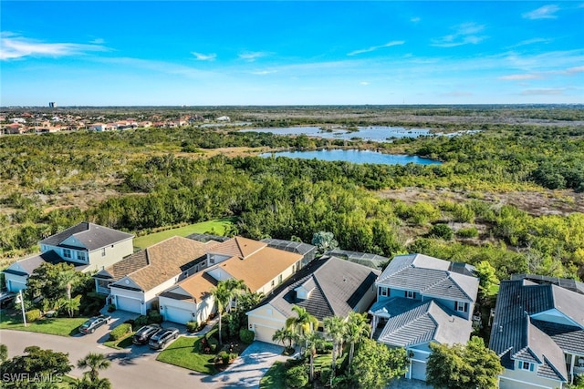 birds eye view of property featuring a water view and a residential view